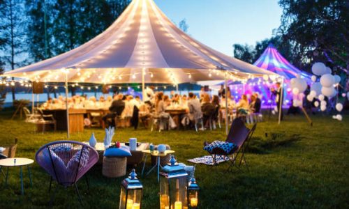 Colorful wedding tents at night. Wedding day.