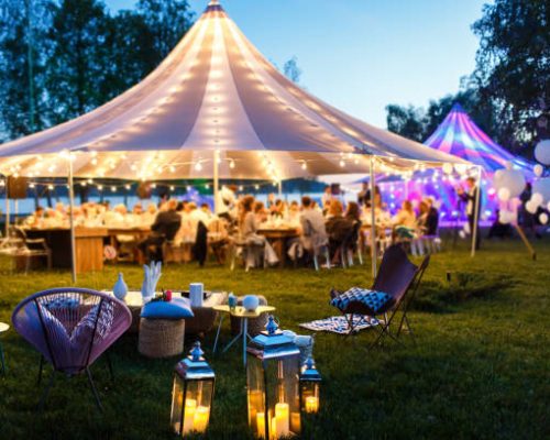 Colorful wedding tents at night. Wedding day.